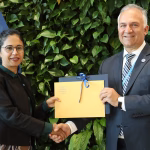 WHO Welcomes IOM as.jpg